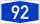 Blauw rechthoekig verkeersbord met wit nummer 92 dat snelweg- of routenummer aangeeft voor navigatie en reisrichtingen