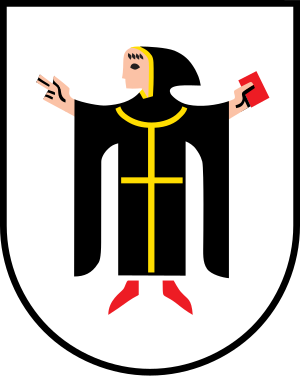 Monnik Wapen met Boek en Kruis Wapen met een monnik in zwarte mantel met gele kruis die een boek vasthoudt en een gebaar maakt op een wit schild