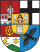 Heraldisch wapenschild met leeuw, fleur-de-lis en vogel Wapenschild met een leeuw, fleur-de-lis en een zwarte vogel op een schild verdeeld in vier kwadranten met rode en gele kleuren